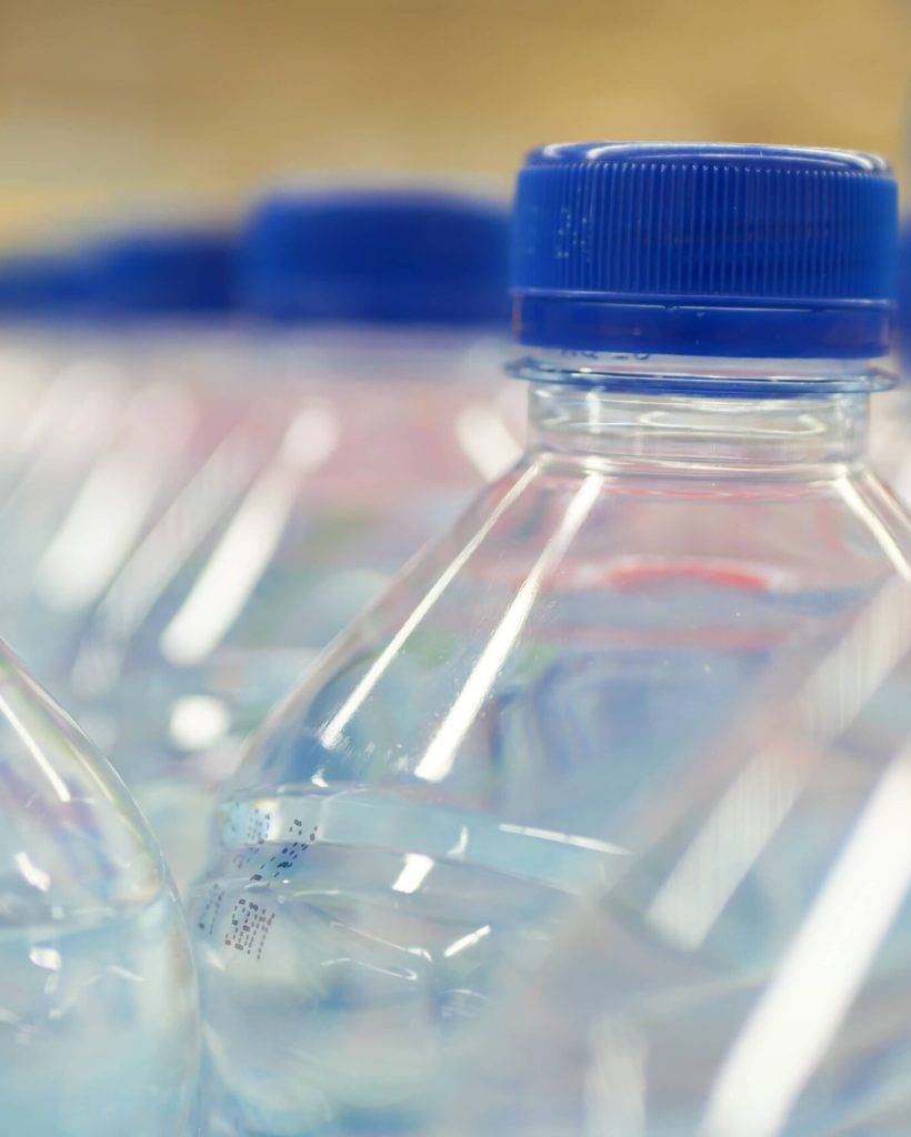 plastic-bottles-of-soft-drink-on-table-2023-11-27-05-33-46-utc (1)